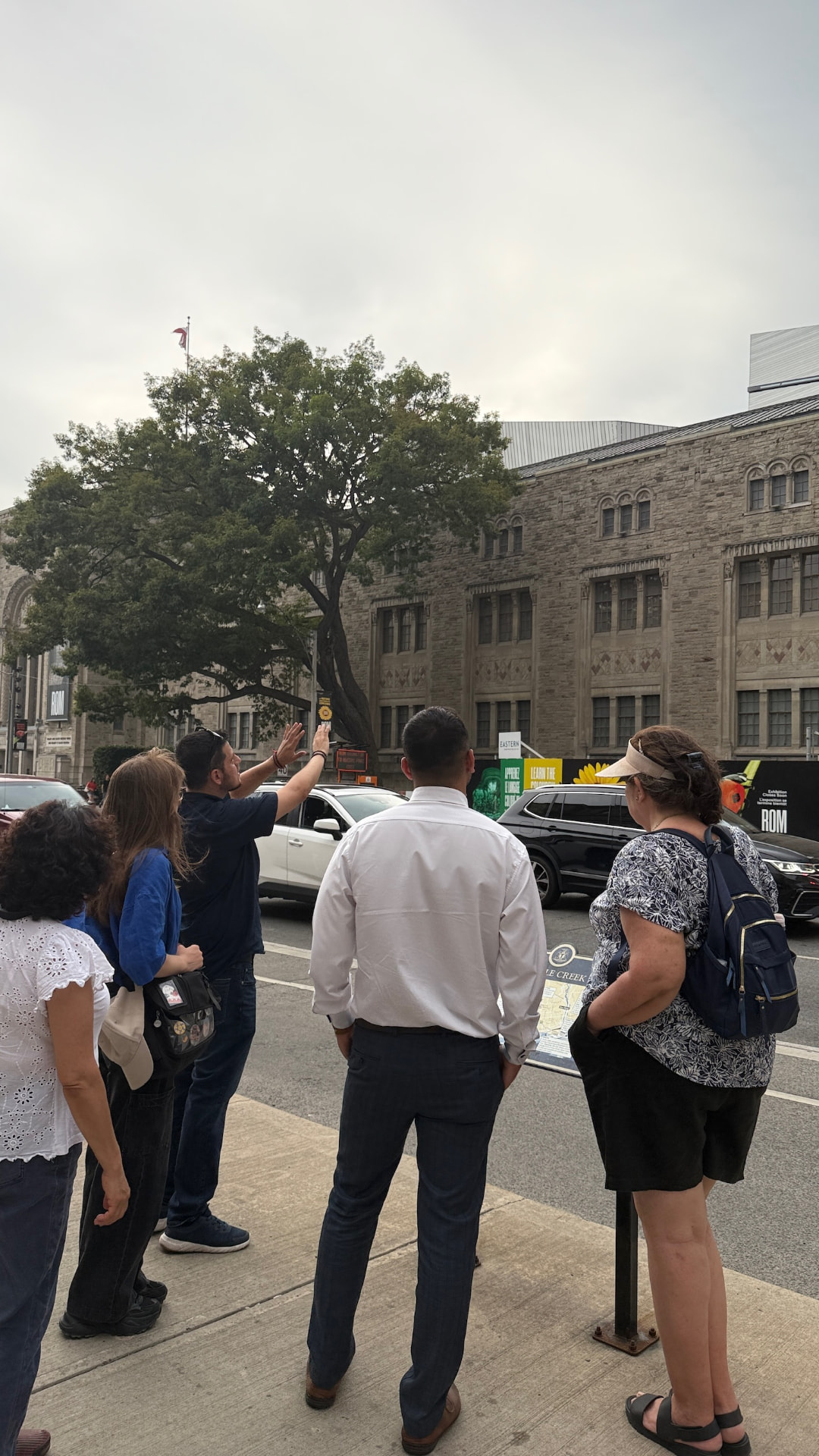 A Touronto group at Bloor Street looking up at the Royal Ontario Museum
