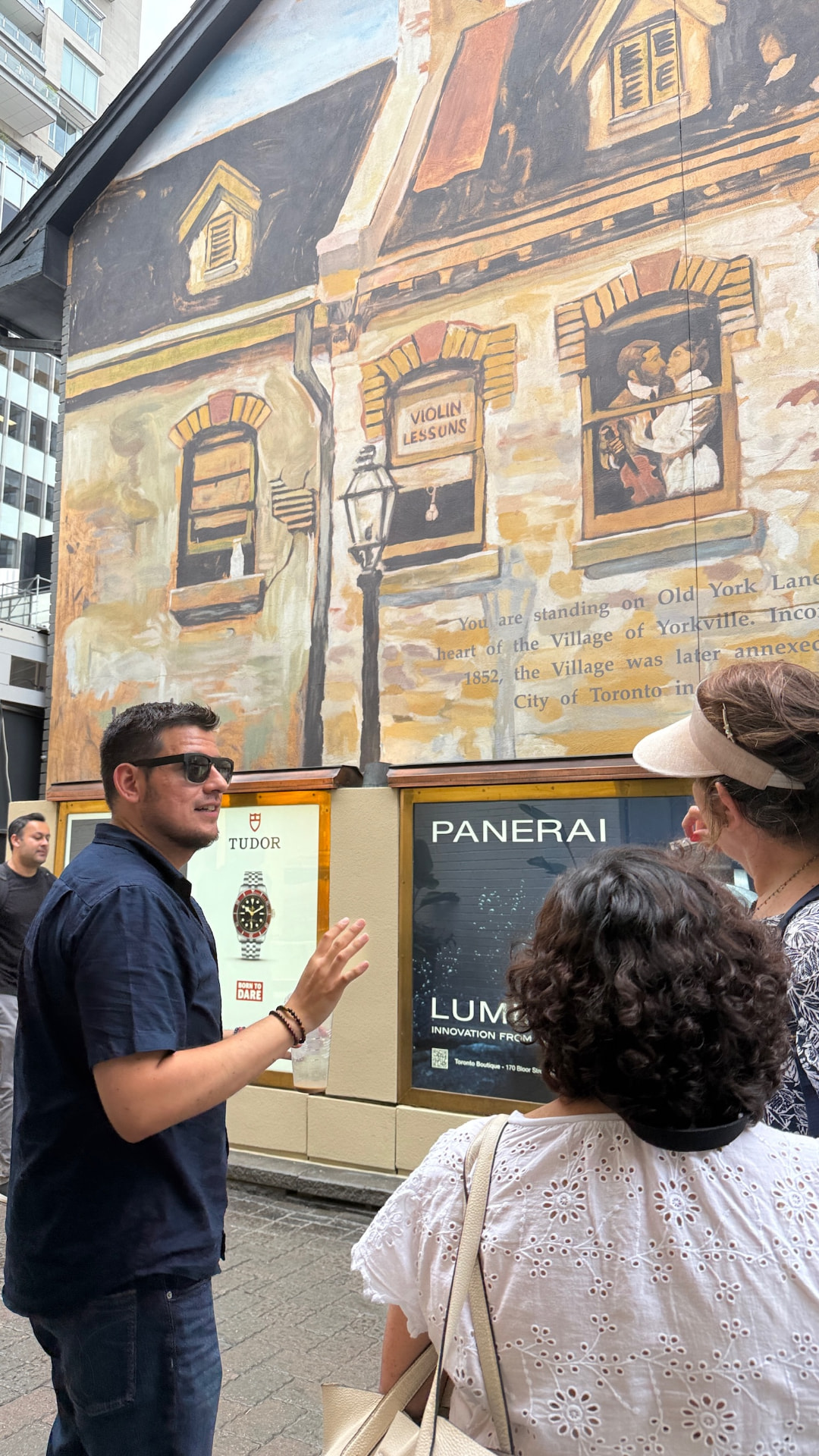 Mike explaining the Old York Lane mural to guests in Yorkville
